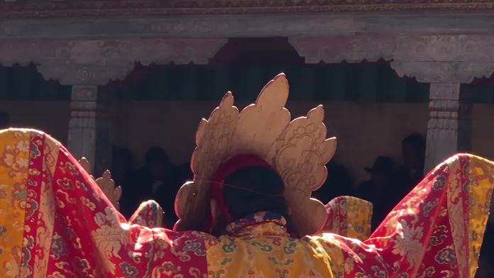 Tsechu morning in Bumthang: masked dancers, brocade and drums in the dzong courtyard